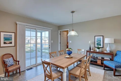 a view of a dining room with furniture window and outside view
