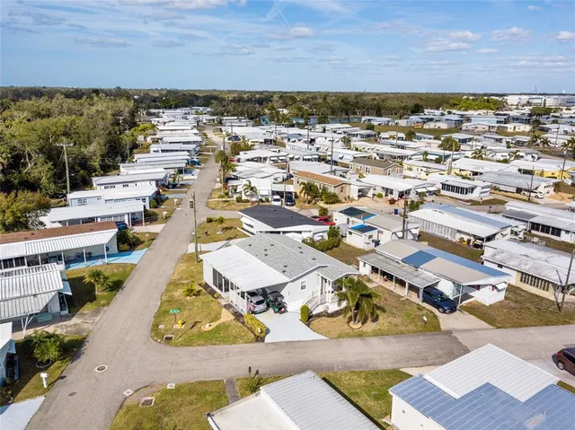 an aerial view of residential houses with outdoor space