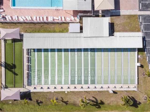 a living room with pool table and a projector