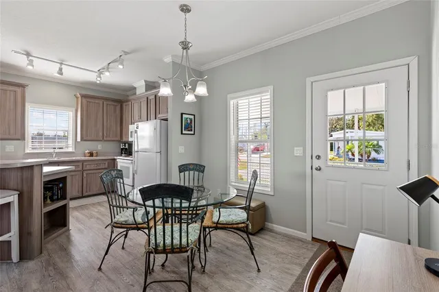 a view of a dining room with furniture and window
