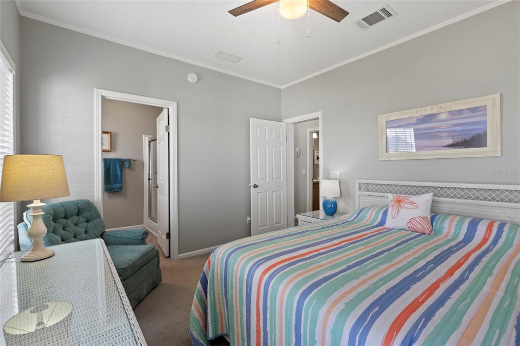 4104 11th Street East Ellenton, FL 34222 - Photo 6 of 20 a bedroom with a bed and a couch