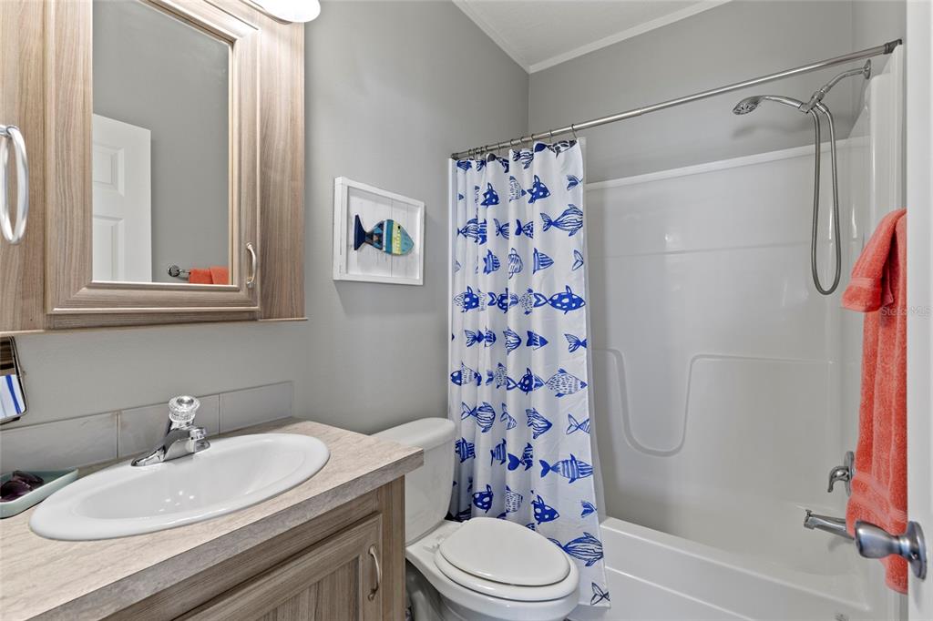 4104 11th Street East Ellenton, FL 34222 - Photo 8 of 20 a bathroom with a sink toilet and shower