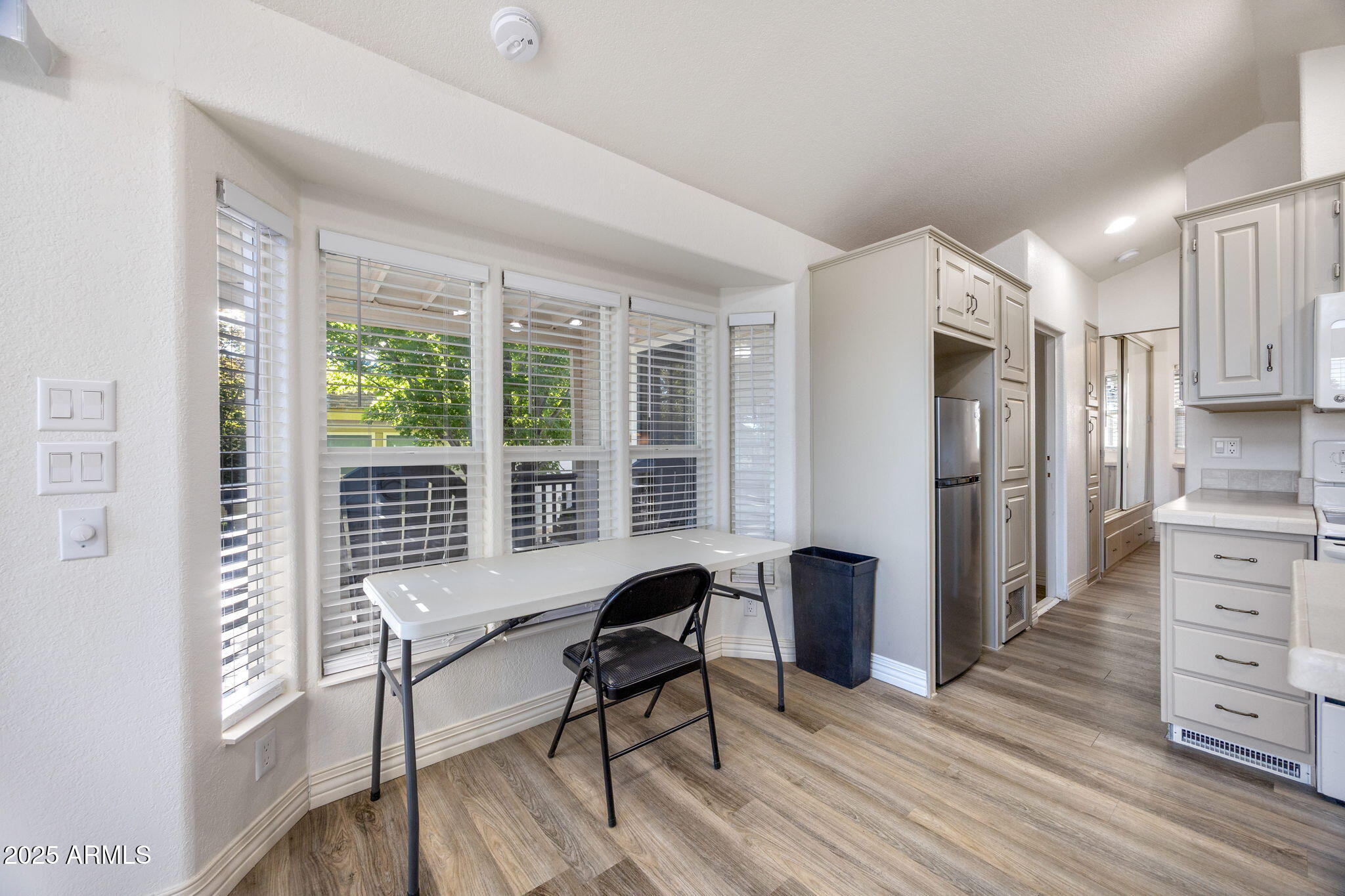 2209 Old Crooks Trail Overgaard, AZ 85933 - Photo 9 of 38 a living room with furniture and a window