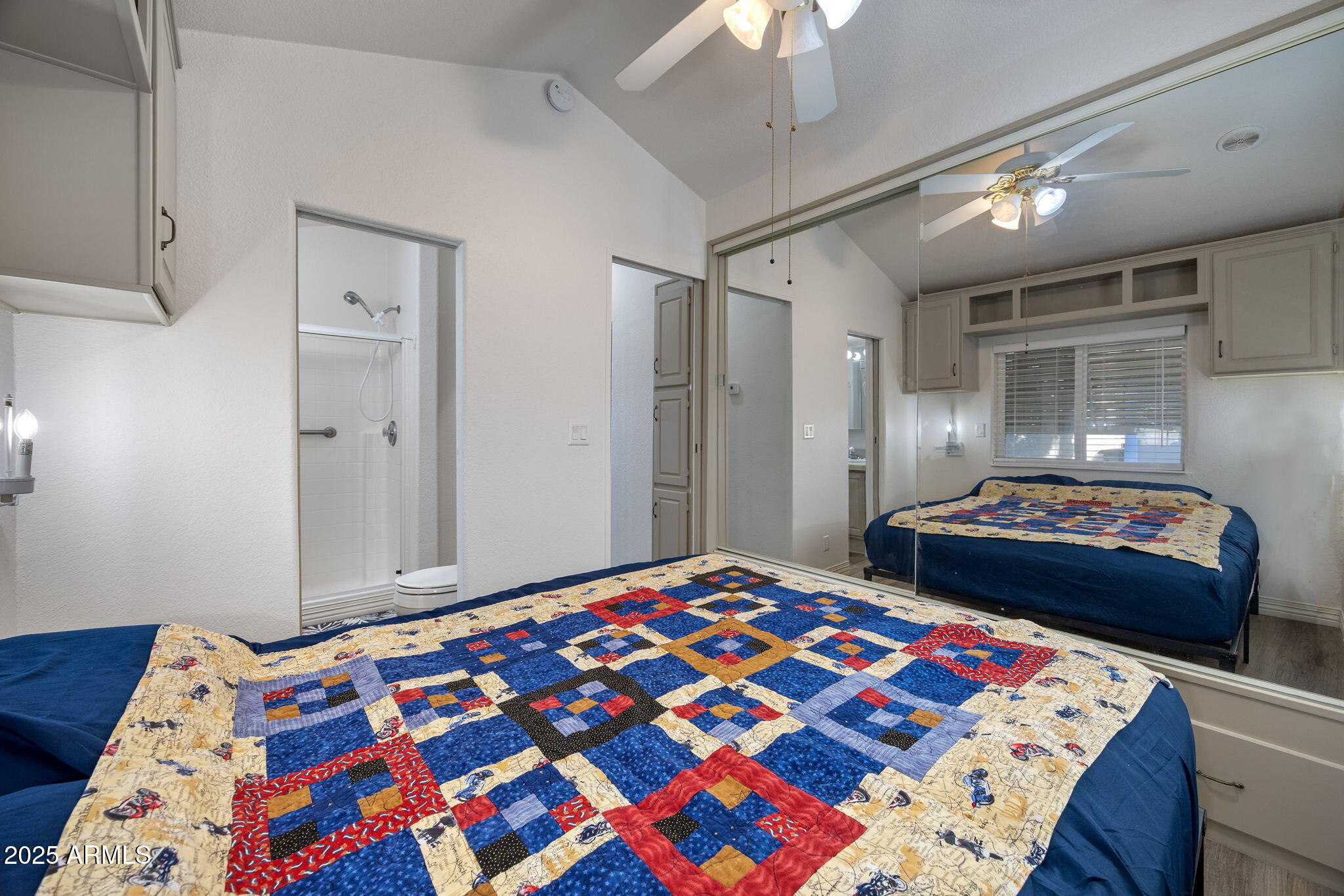 2209 Old Crooks Trail Overgaard, AZ 85933 - Photo 13 of 38 a bedroom with a bed and a lamp