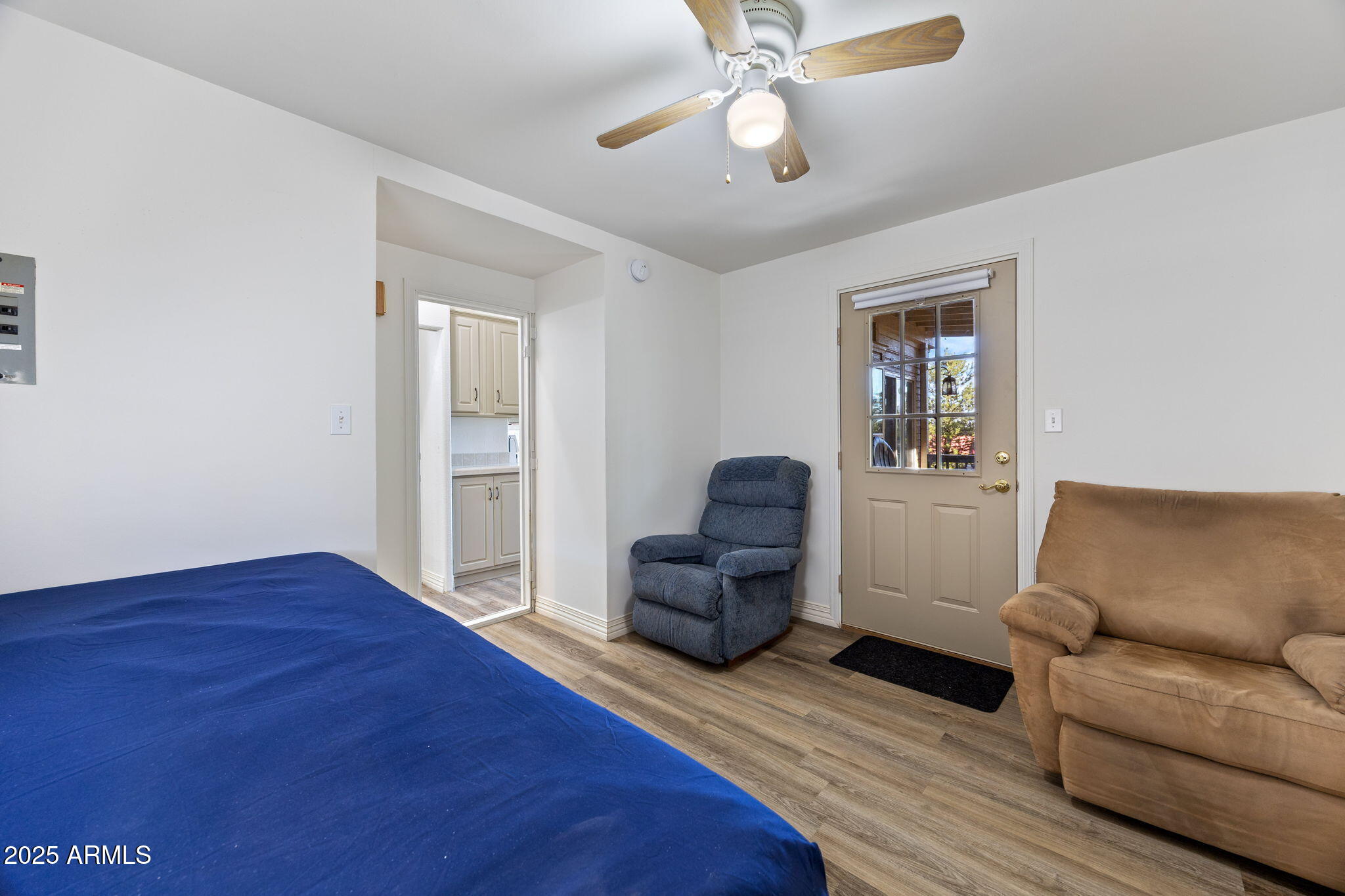 2209 Old Crooks Trail Overgaard, AZ 85933 - Photo 15 of 38 a living room with furniture and a wooden floor