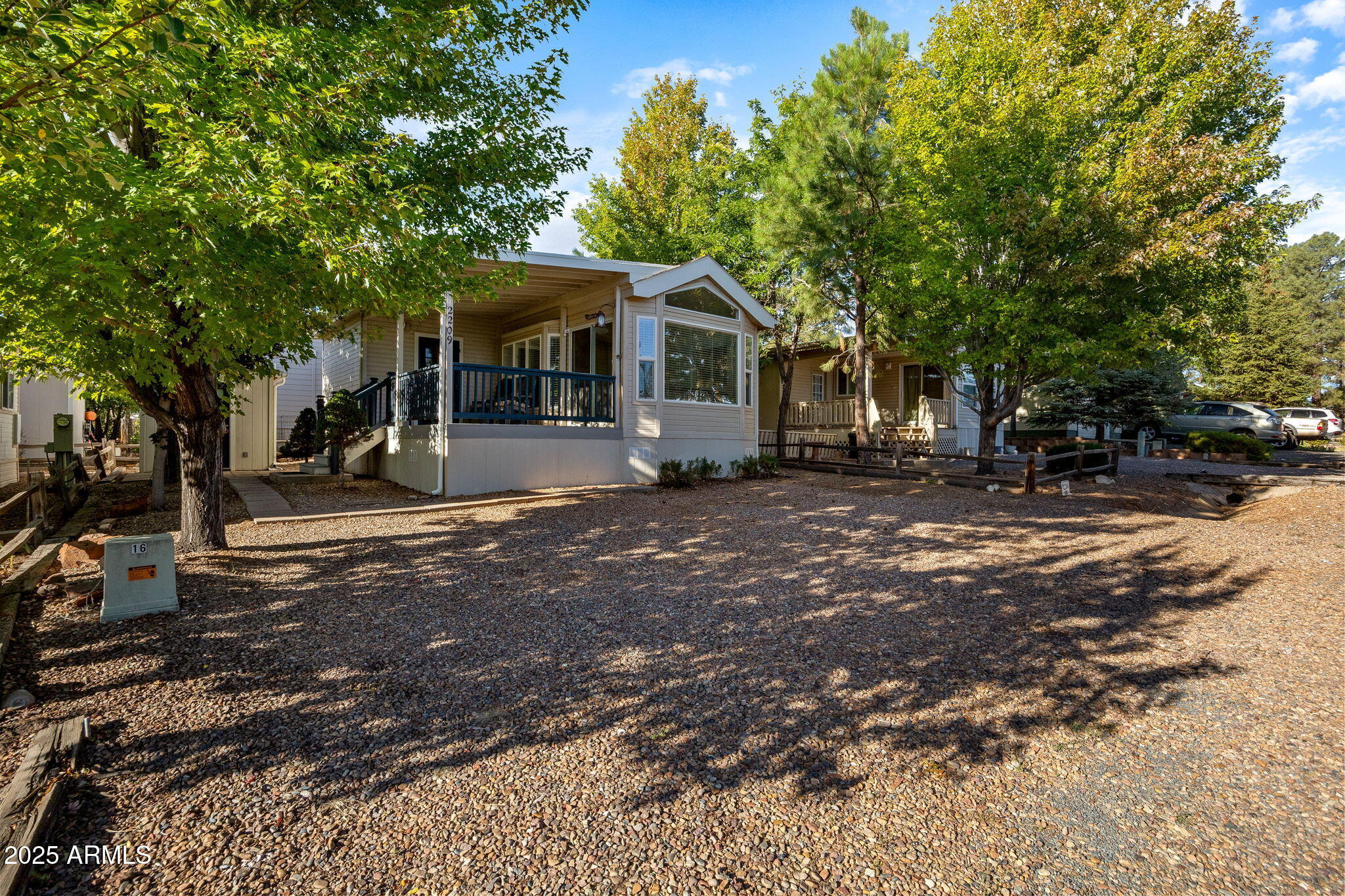 2209 Old Crooks Trail Overgaard, AZ 85933 - Photo 3 of 38 a view of a house with a tree in the background