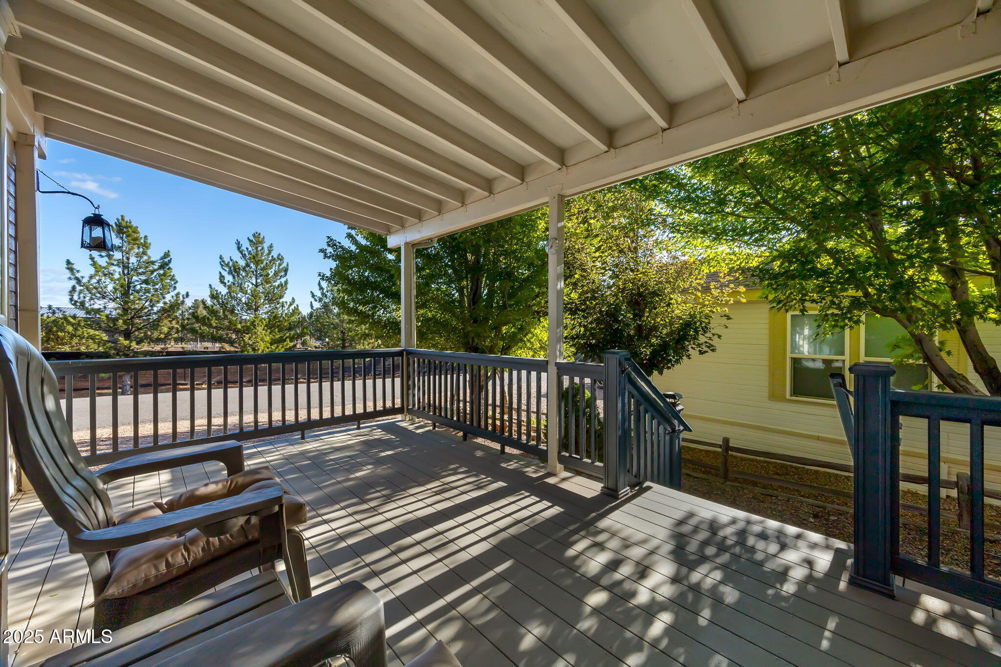 2209 Old Crooks Trail Overgaard, AZ 85933 - Photo 4 of 38 a view of a wooden deck with a bench