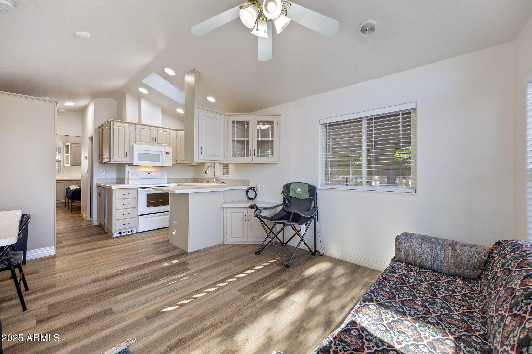 2209 Old Crooks Trail Overgaard, AZ 85933 - Photo 7 of 38 a living room with kitchen island furniture and a window