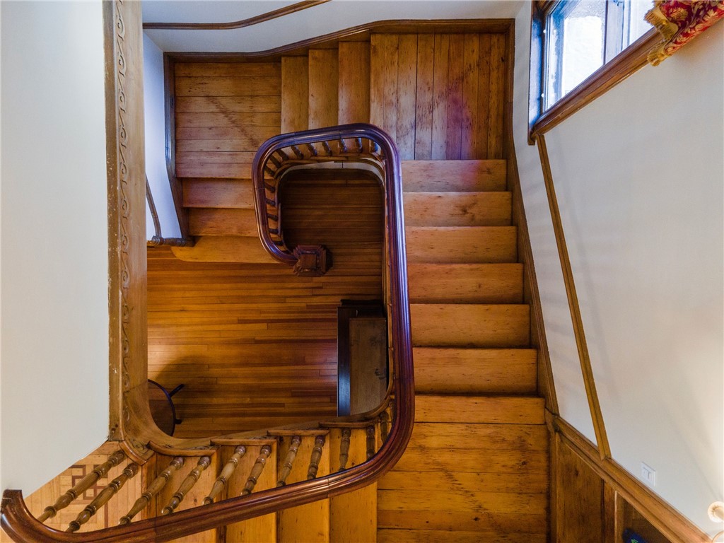 31 Old Beach Road Newport, RI 02840 - Photo 18 of 46 Majestic staircase composed of fir, mahogany, oak, and butternut.