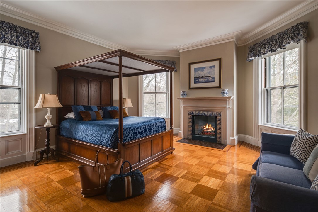 31 Old Beach Road Newport, RI 02840 - Photo 2 of 46 Second level bedroom with fireplace and en suite.