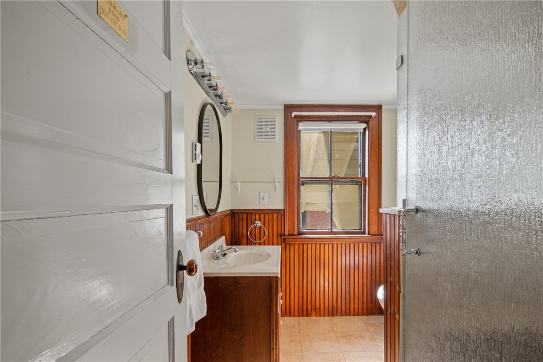31 Old Beach Road Newport, RI 02840 - Photo 31 of 46 Third level bathroom with chair rail bead board accent.