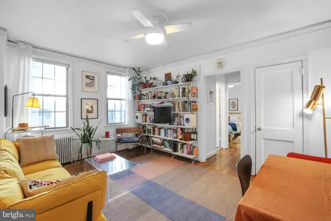 a living room with furniture and a window