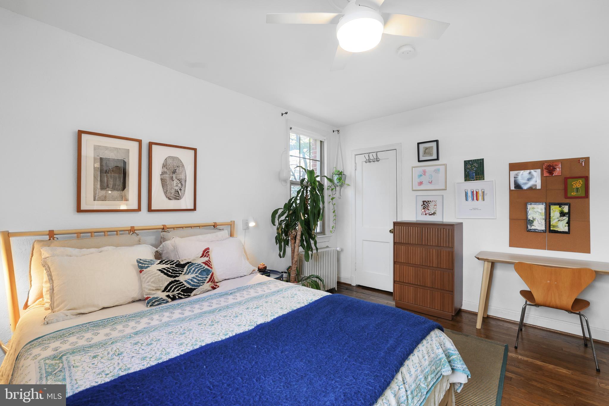 1441 Euclid Street Northwest, Unit 206 Washington, DC 20009 - Photo 11 of 19 a bedroom with a bed and a dresser