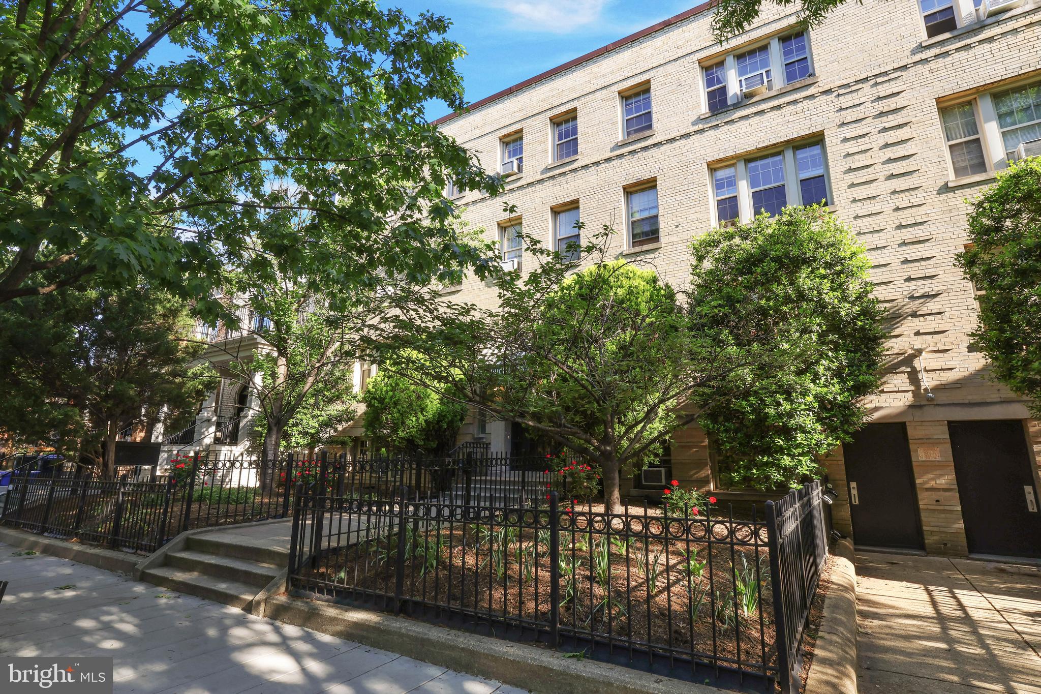 1441 Euclid Street Northwest, Unit 206 Washington, DC 20009 - Photo 16 of 19 a front view of a building with trees