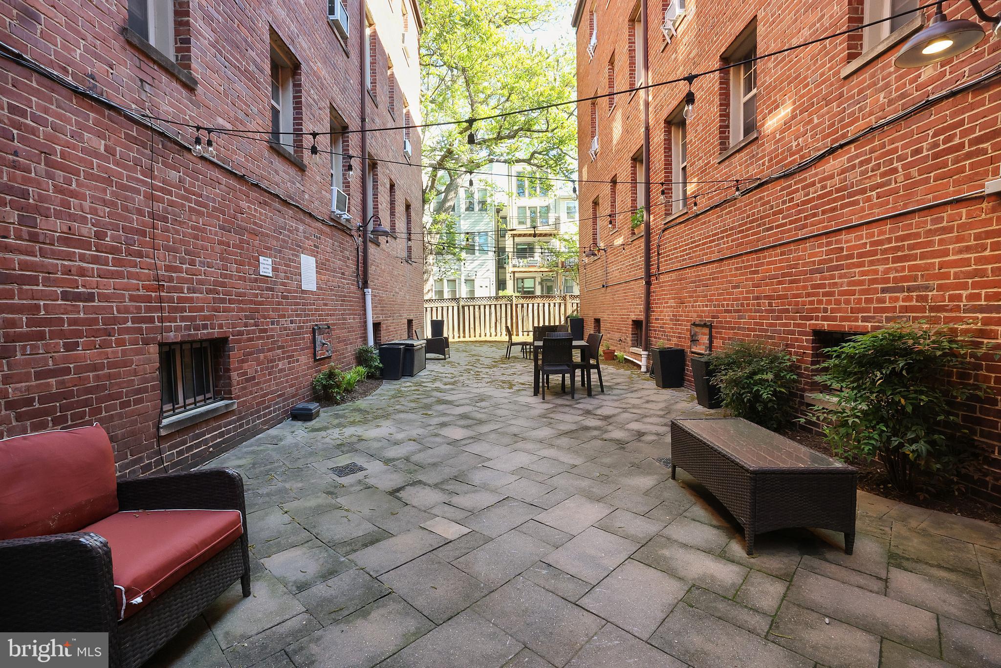 1441 Euclid Street Northwest, Unit 206 Washington, DC 20009 - Photo 19 of 19 a backyard of a house with seating space