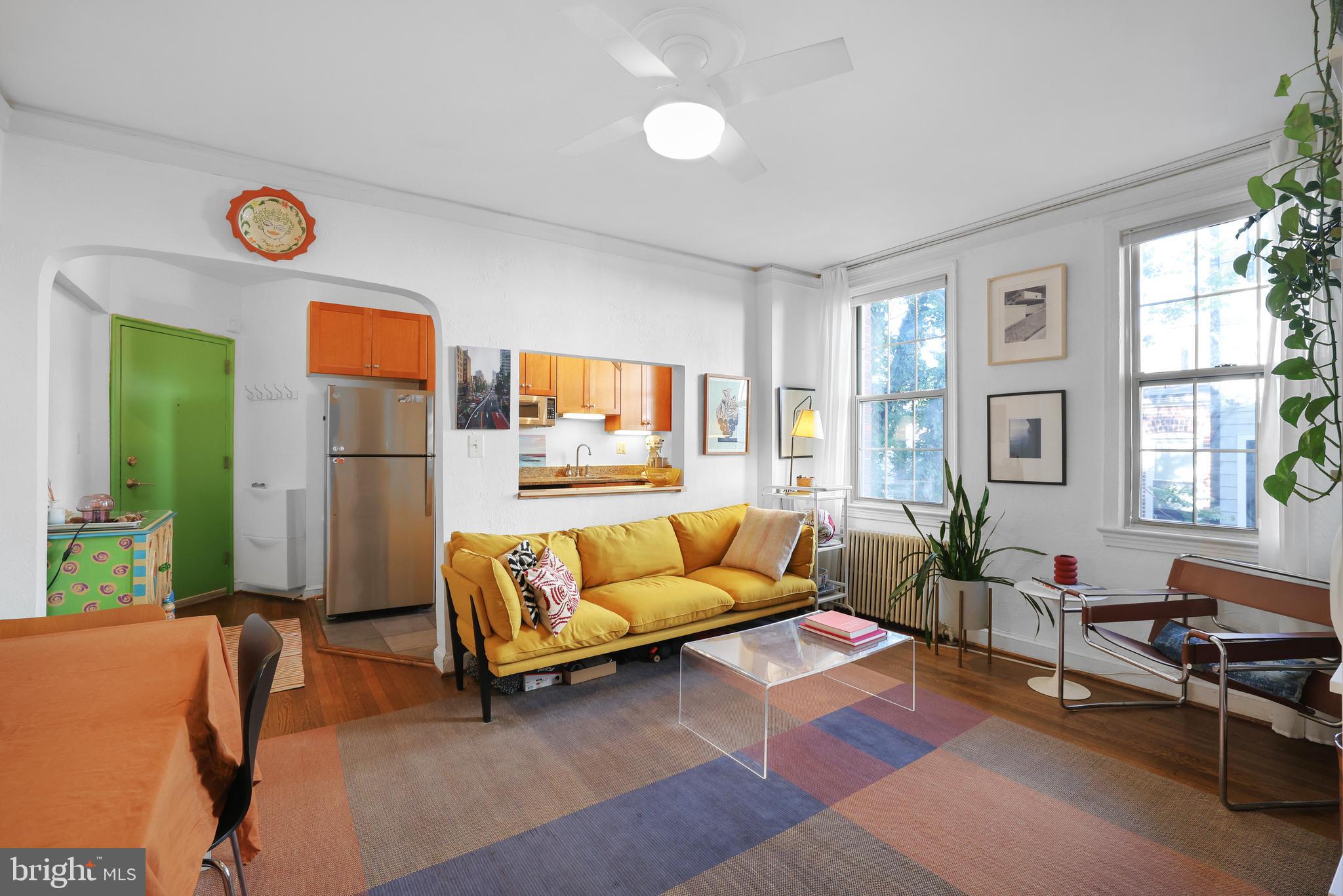 1441 Euclid Street Northwest, Unit 206 Washington, DC 20009 - Photo 2 of 19 a living room with furniture and a large window
