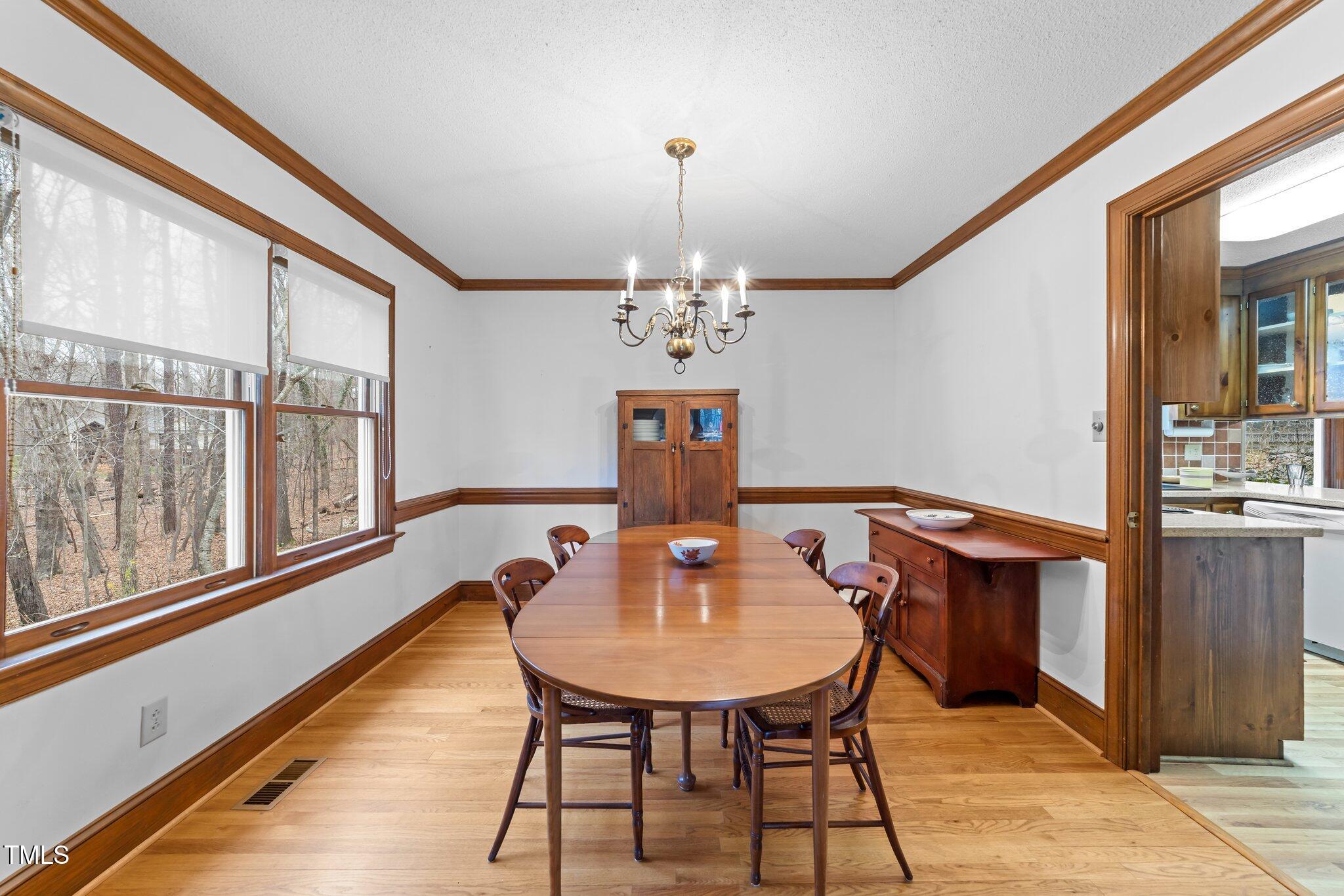 5012 Springwood Drive Raleigh, NC 27613 - Photo 8 of 44 a dining room with furniture and window