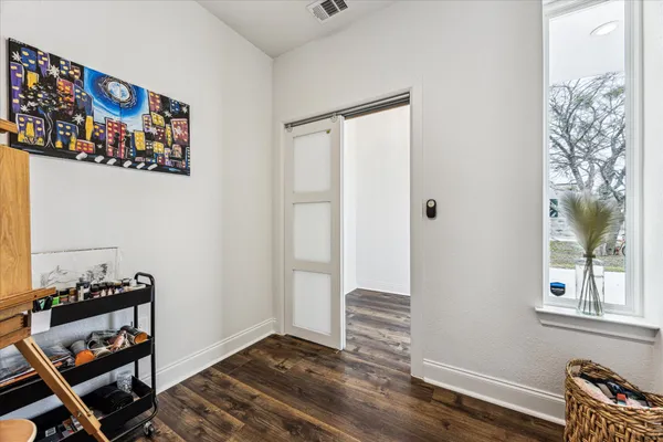 a view of a room with toys and wooden floor