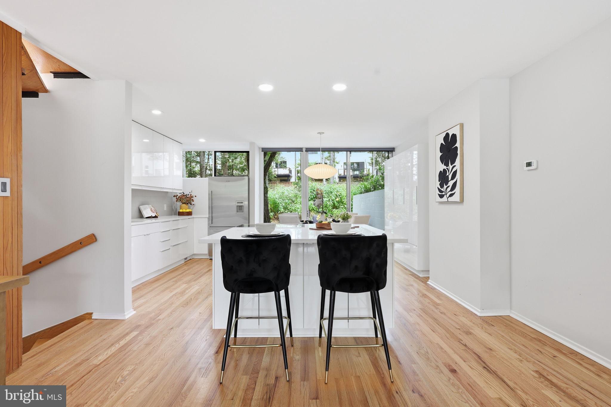 11510 Maple Ridge Road Reston, VA 20190 - Photo 3 of 43 a view of a dining room with furniture and wooden floor