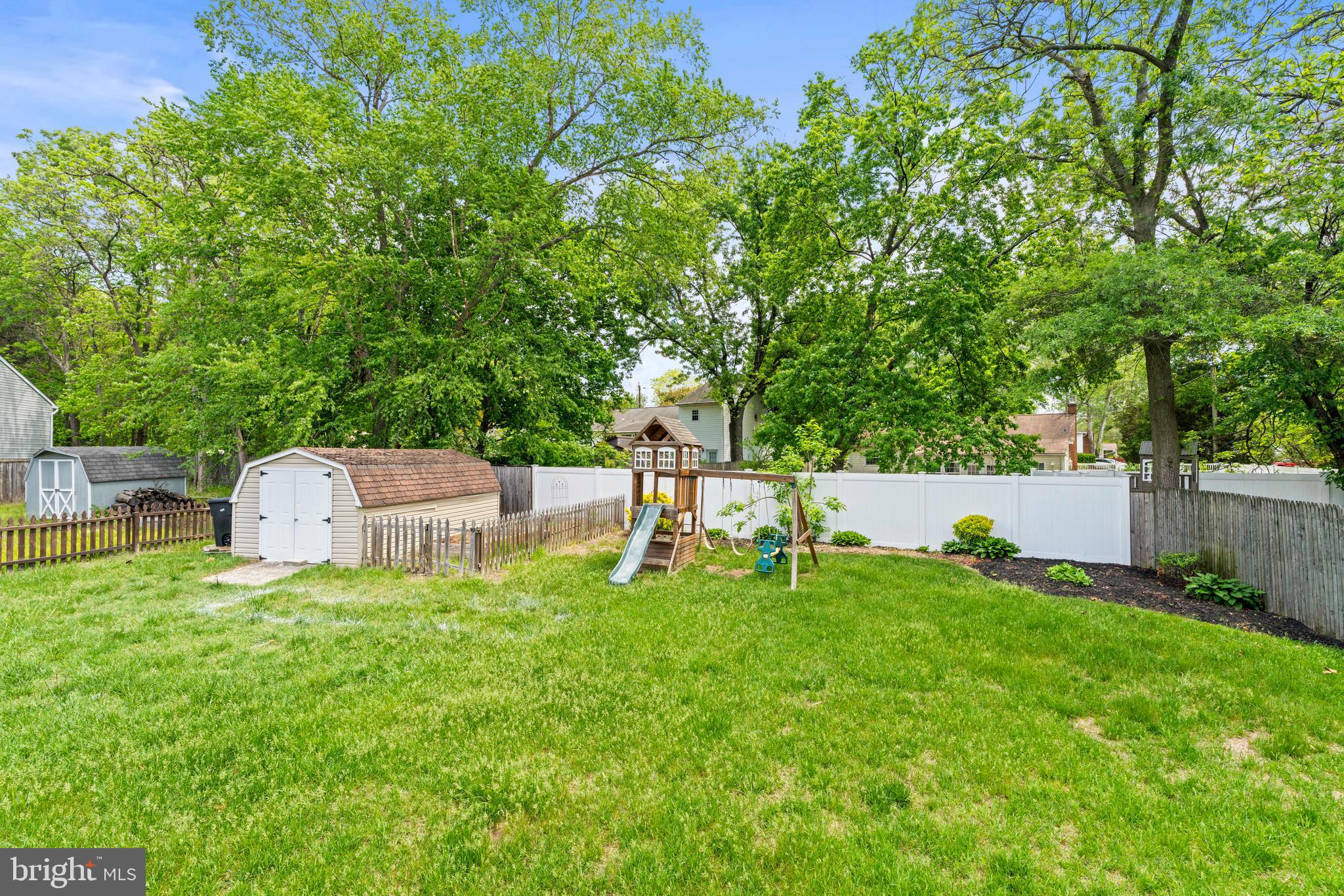 8289 WB&A Road Severn, MD 21144 - Photo 39 of 45 a backyard of a house with table and chairs
