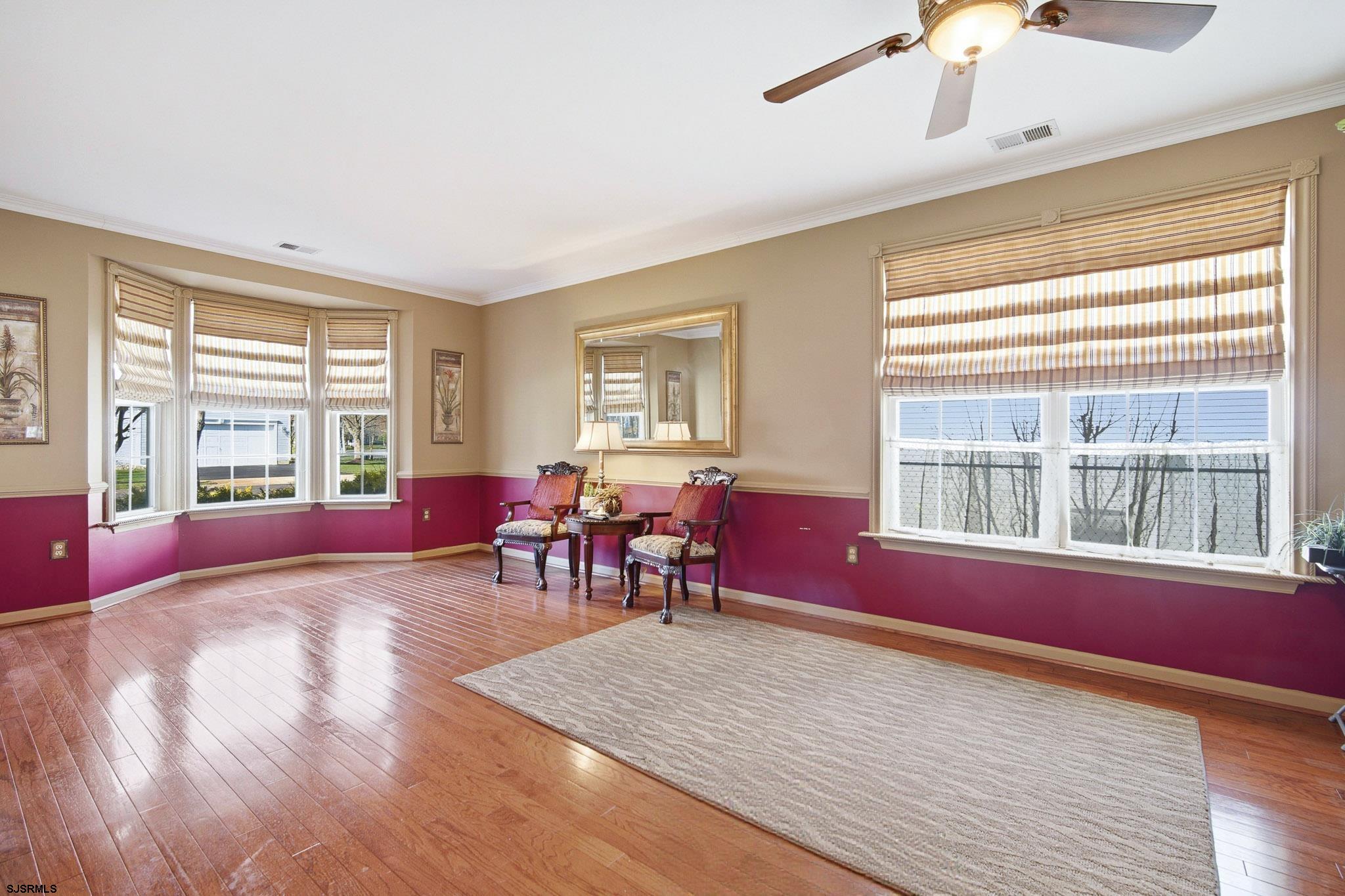 102 Warwick Road Galloway Township, NJ 08205 - Photo 5 of 45 a living room with furniture large window and wooden floor