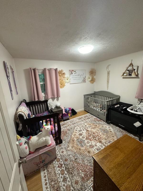 2902 Bacchus Road Elliston, VA 24087 - Photo 13 of 23 a bedroom with a bed and window