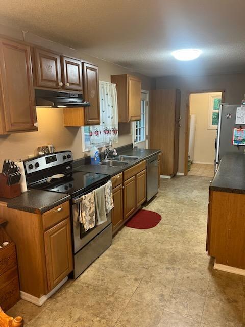 2902 Bacchus Road Elliston, VA 24087 - Photo 6 of 23 a kitchen with stainless steel appliances granite countertop a sink stove and cabinets
