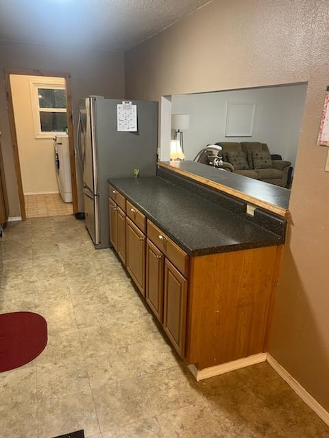 2902 Bacchus Road Elliston, VA 24087 - Photo 7 of 23 a kitchen with stainless steel appliances granite countertop a stove a sink and a refrigerator