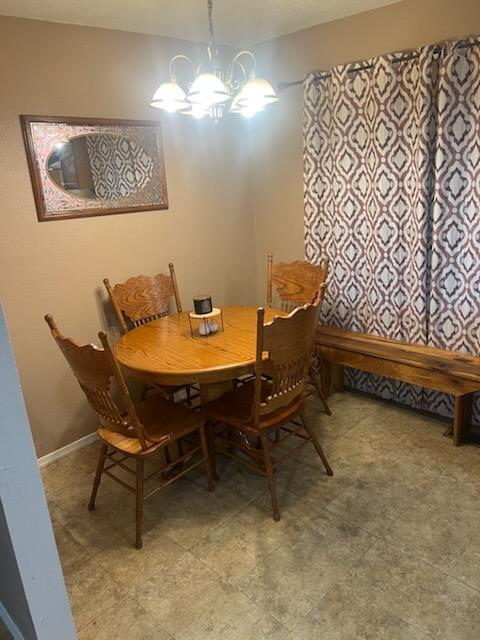 2902 Bacchus Road Elliston, VA 24087 - Photo 8 of 23 a dining room with furniture and chandelier