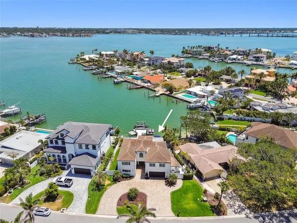 an aerial view of a house with a lake view