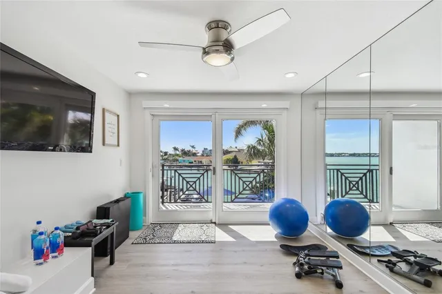 a kitchen with stainless steel appliances granite countertop a refrigerator a stove and a sink