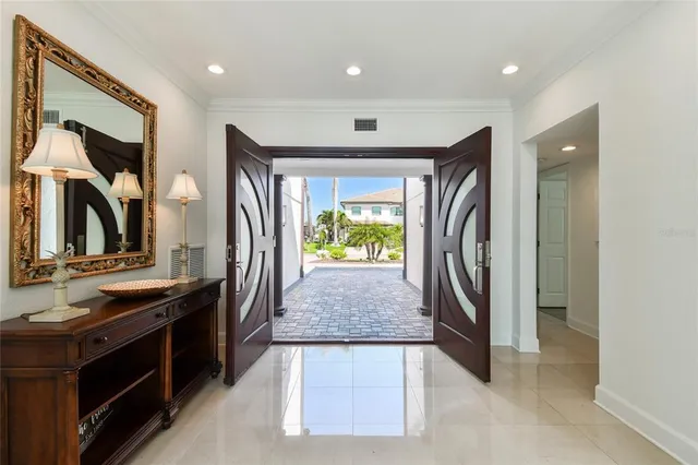a view of a sink and dishwasher with white cabinets
