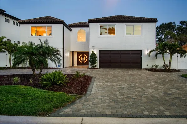 a kitchen with stainless steel appliances granite countertop a barbecue stove and view of living room