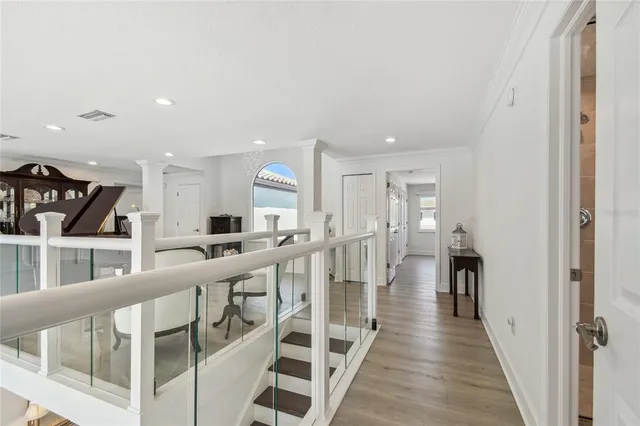 a view of a balcony with wooden floor and outdoor space