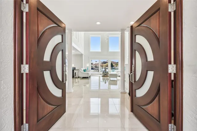 an aerial view of a house with a lake view