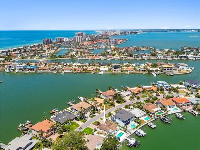 a dining room with furniture a chandelier and window