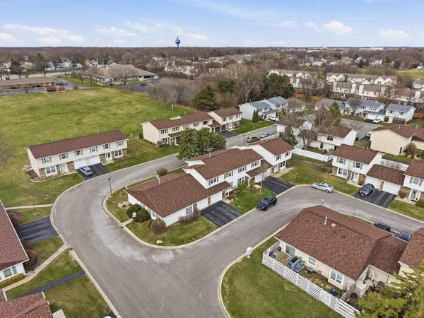 an aerial view of a house with outdoor space
