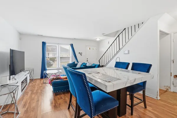 a view of a dining room with furniture window and wooden floor