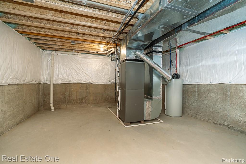 201 Beechview Drive Rochester, MI 48306 - Photo 38 of 49 Concrete flooring, exposed joist ceiling, concrete foundation walls, furnace, water heater