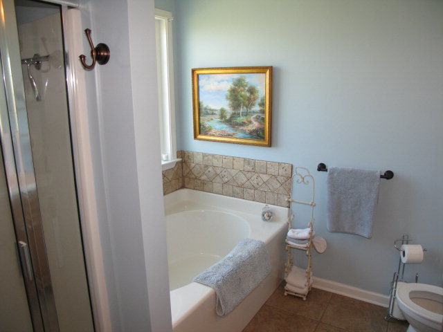 477 Bob White Road Macon, GA 31216 - Photo 14 of 21 a white bath tub sitting next to a white toilet