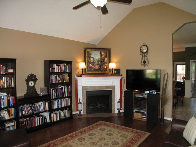 477 Bob White Road Macon, GA 31216 - Photo 3 of 21 a living room with fireplace furniture and a flat screen tv