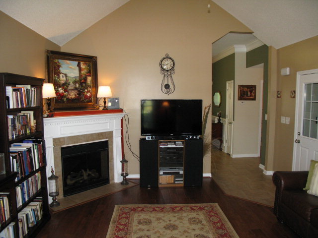 477 Bob White Road Macon, GA 31216 - Photo 4 of 21 a living room with fireplace furniture and a flat screen tv