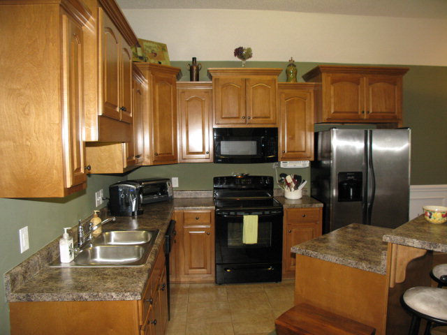 477 Bob White Road Macon, GA 31216 - Photo 8 of 21 a kitchen with stainless steel appliances granite countertop a sink a stove and a refrigerator