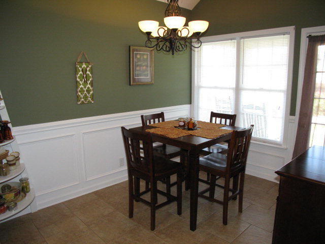 477 Bob White Road Macon, GA 31216 - Photo 9 of 21 a view of a dining room with furniture a chandelier and a window