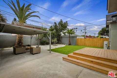 a view of backyard with outdoor seating
