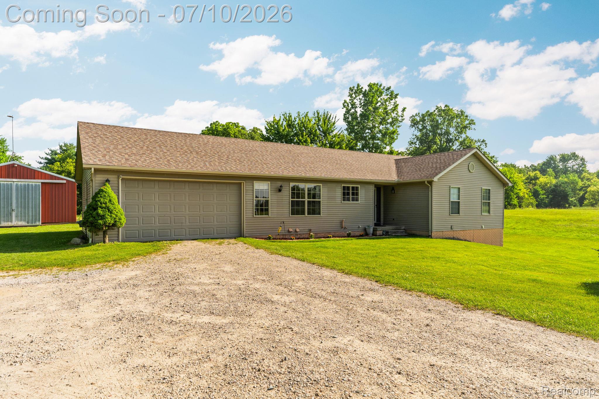 3144 North Nicholson Road Fowlerville, MI 48836 - Photo 19 of 70 Ranch-style residence featuring light green siding and a brown shingle roof
