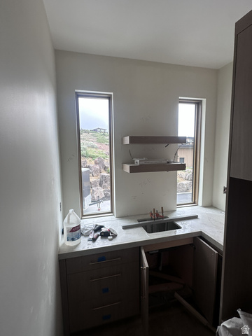 1918 Chimney Rock Road Heber City, UT 84032 - Photo 31 of 74 Built-in cabinetry with flat-panel doors, a countertop with an integrated sink, and two rectangular windows