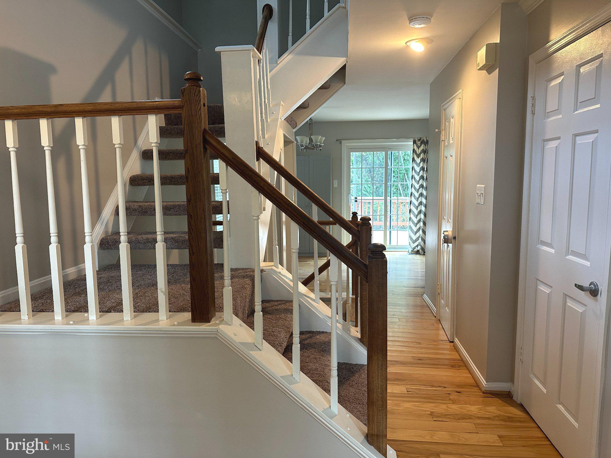 11928 Sentinel Point Court Reston, VA 20191 - Photo 12 of 23 Inviting entryway with elegant staircase.