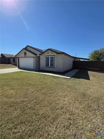 a bathroom with a granite countertop sink a mirror and vanity