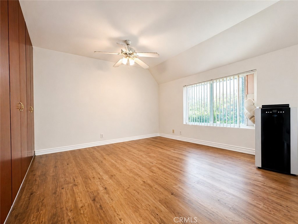 25 Brookfield Irvine, CA 92604 - Photo 11 of 17 an empty room with wooden floor fan and windows
